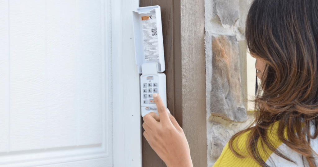 Woman enters garage code on wall keypad.