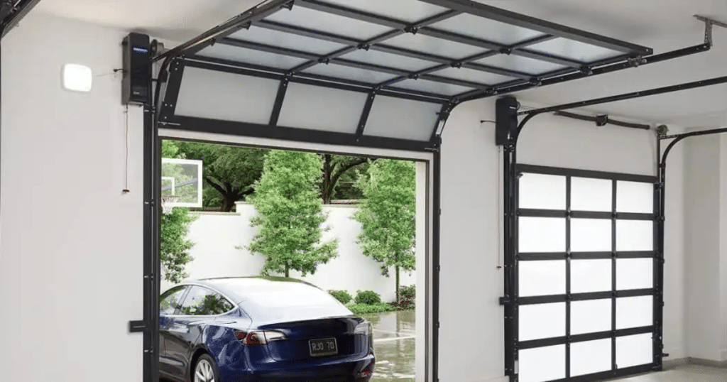 Modern garage with car and door open.