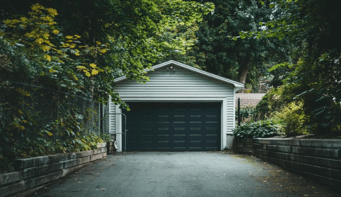 Black Garage Doors on White House