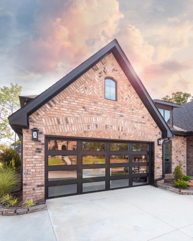Black Garage Doors on Red Brick