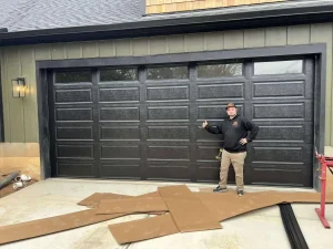 Man next to garage door repair.